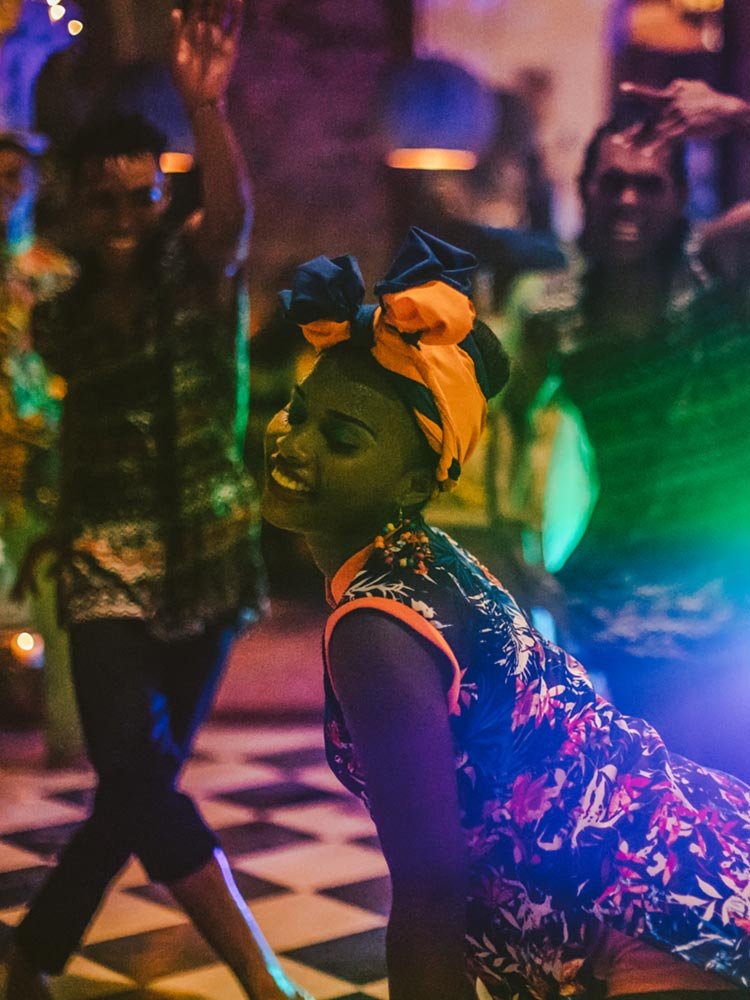 Dancers in colourful Colombian costume dancing champeta, great things to do in Cartagena at the Amarla Boutique Hotel