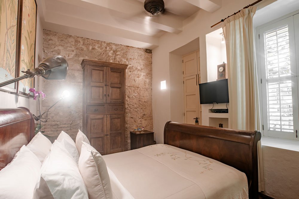 Stunning Hummingbird suite at Amarla Boutique Hotel Cartagena with art above bed